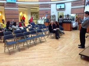 Museum Technician and Gallaudet Alum Drew Robarge speaking to Gallauset students.