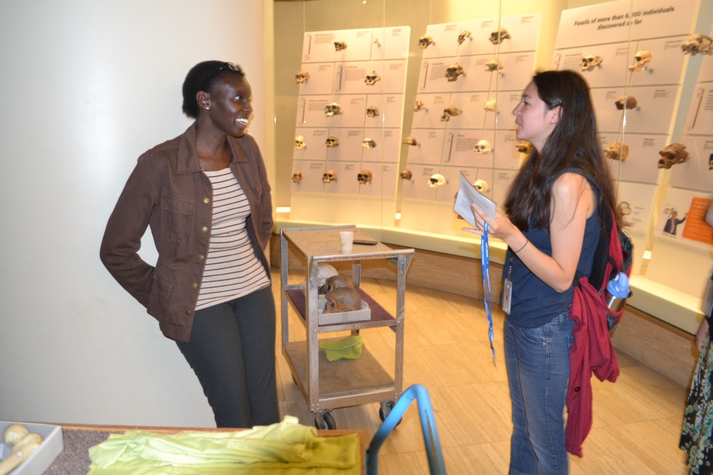 Dr. Habiba Chirchir speaking with students about human morphological changes in the Hall of Human Origins.